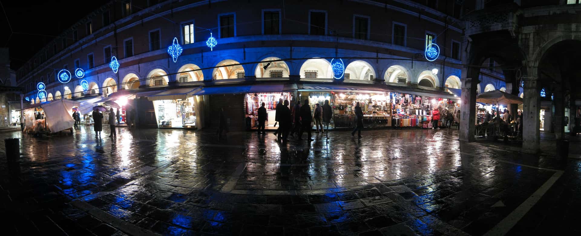 Campo San Giacomo di Rialto reflecting Christmas lights in the rain