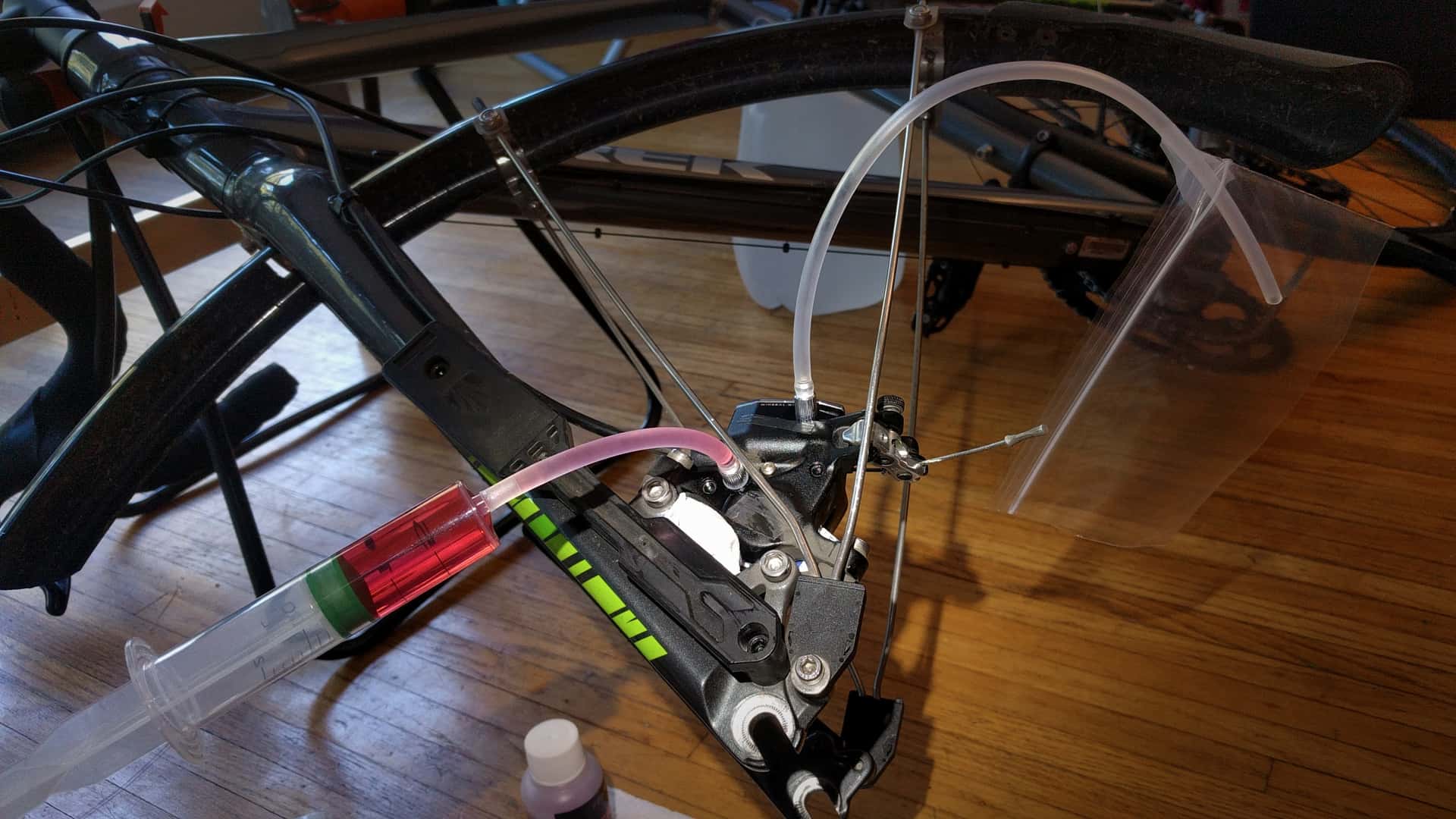 syringe purging air bubbles from a hydraulic disk brake