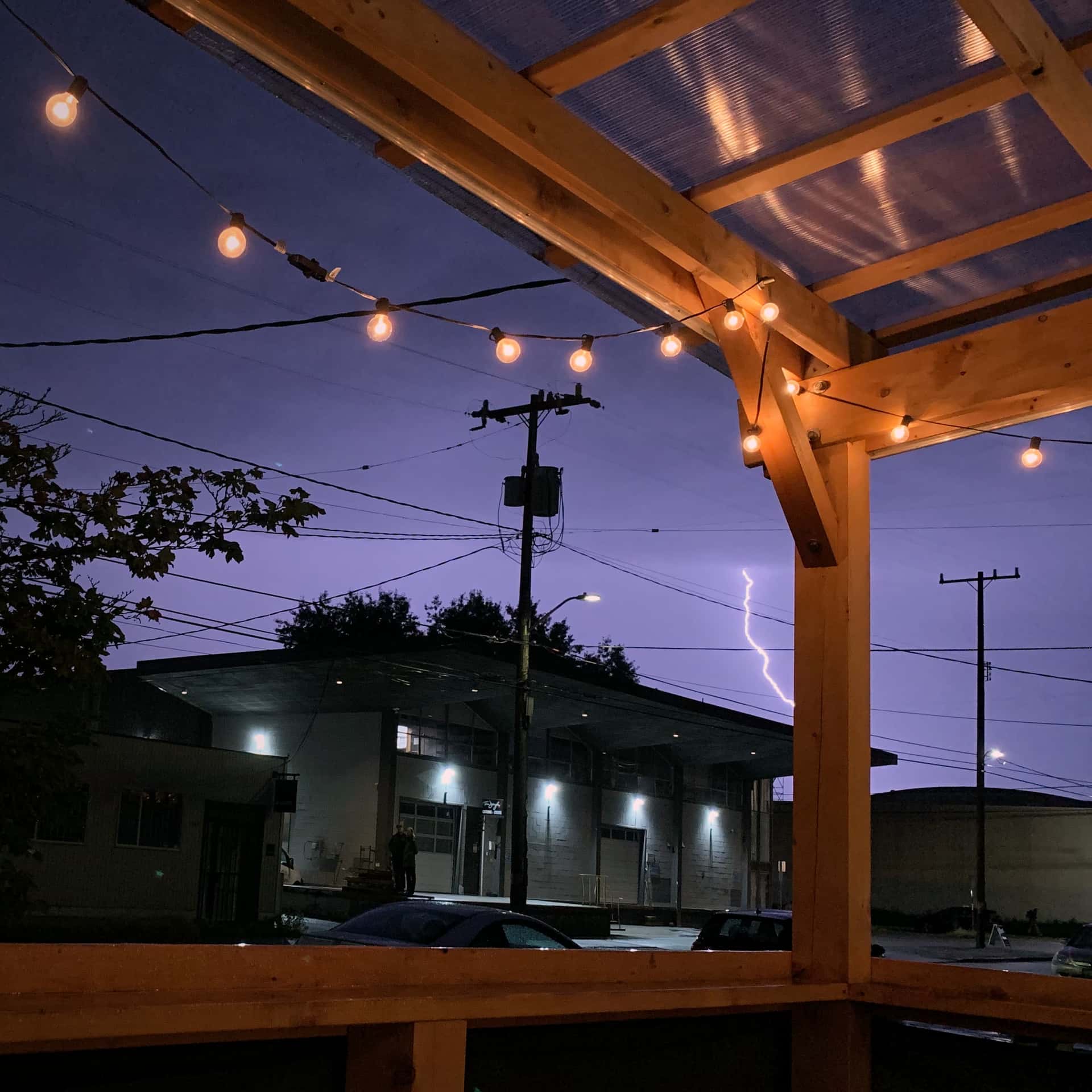 lightning strike seen from Obec Brewing’s covered patio