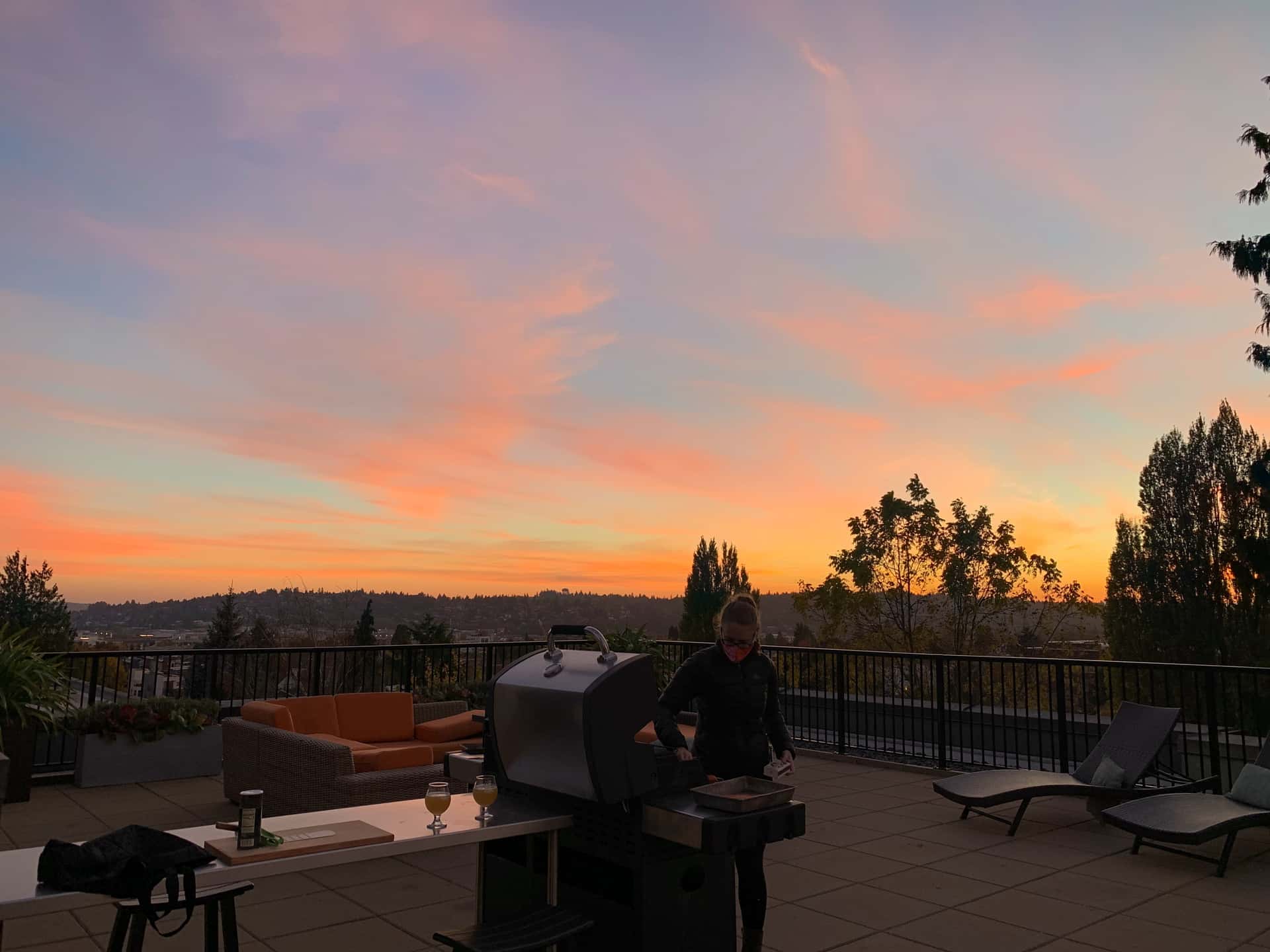rooftop grill under a chromatic sunset