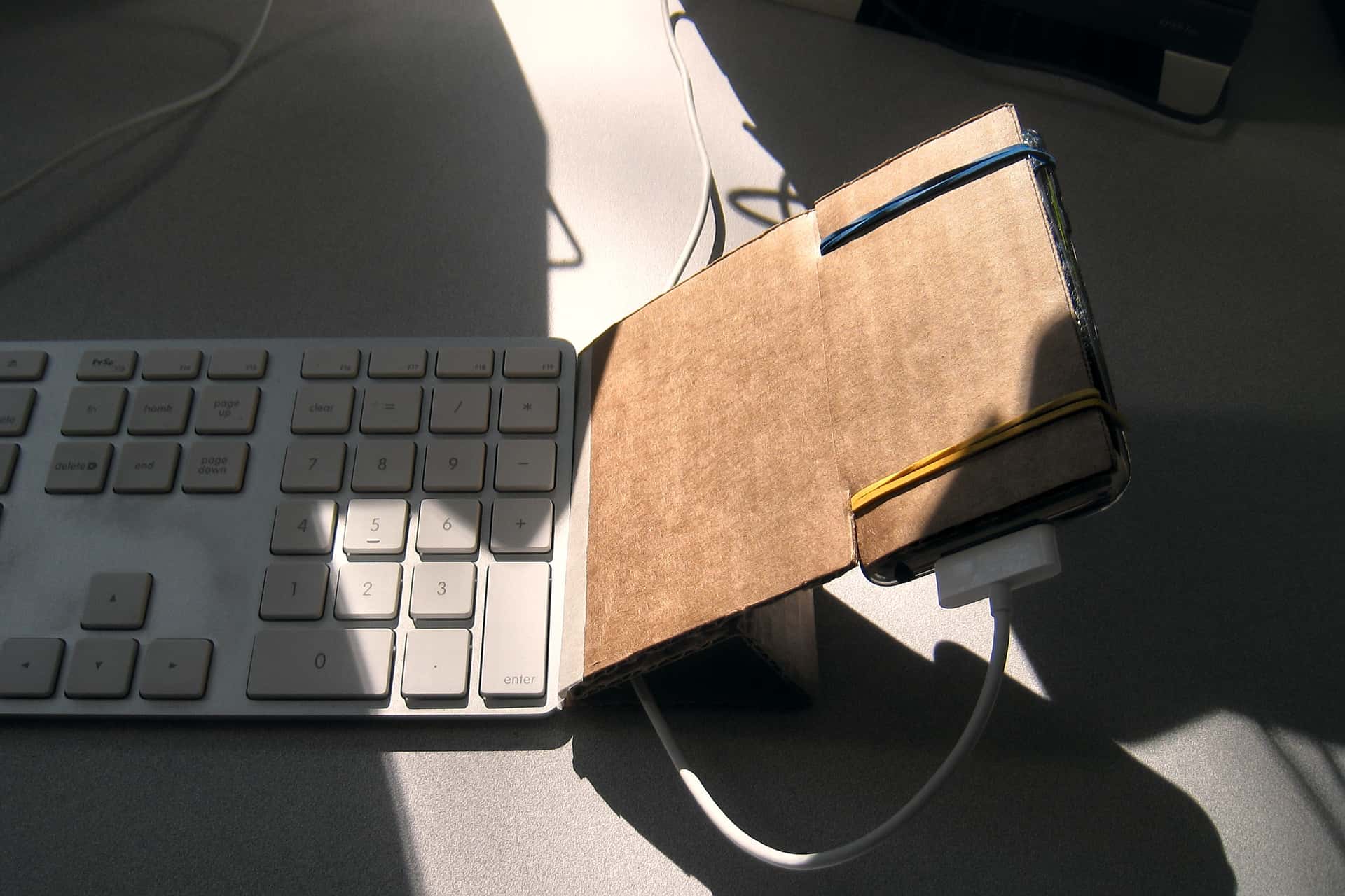 upside-down touchpad constructed from cardboard and an iPad Touch