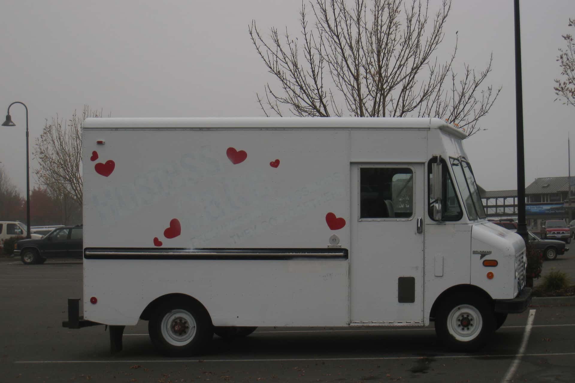 Hostess Cake truck with all of its branding whitewashed except for the hearts