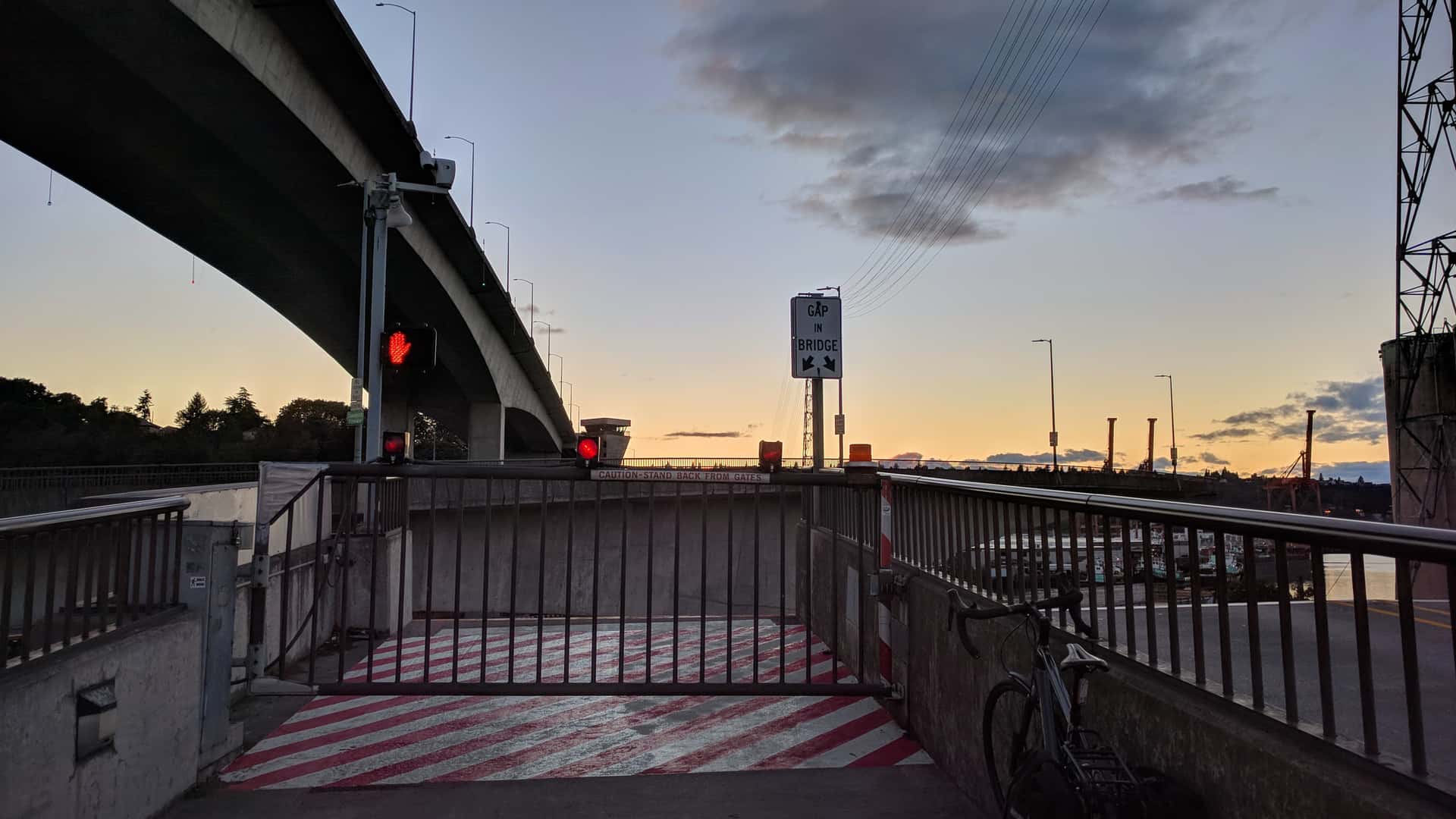 waiting to cross the Spokane Street Bridge on bicycle