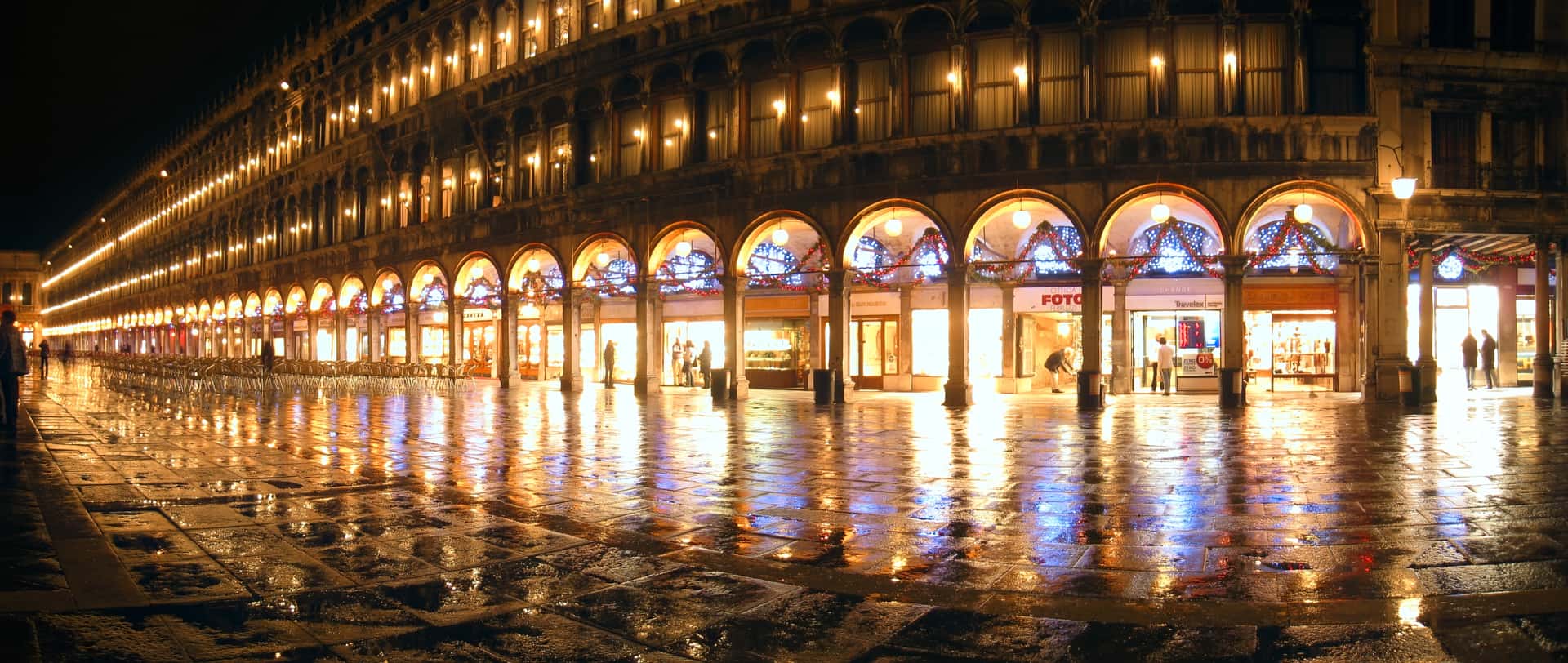 Piazza San Marco reflecting Christmas lights in the rain