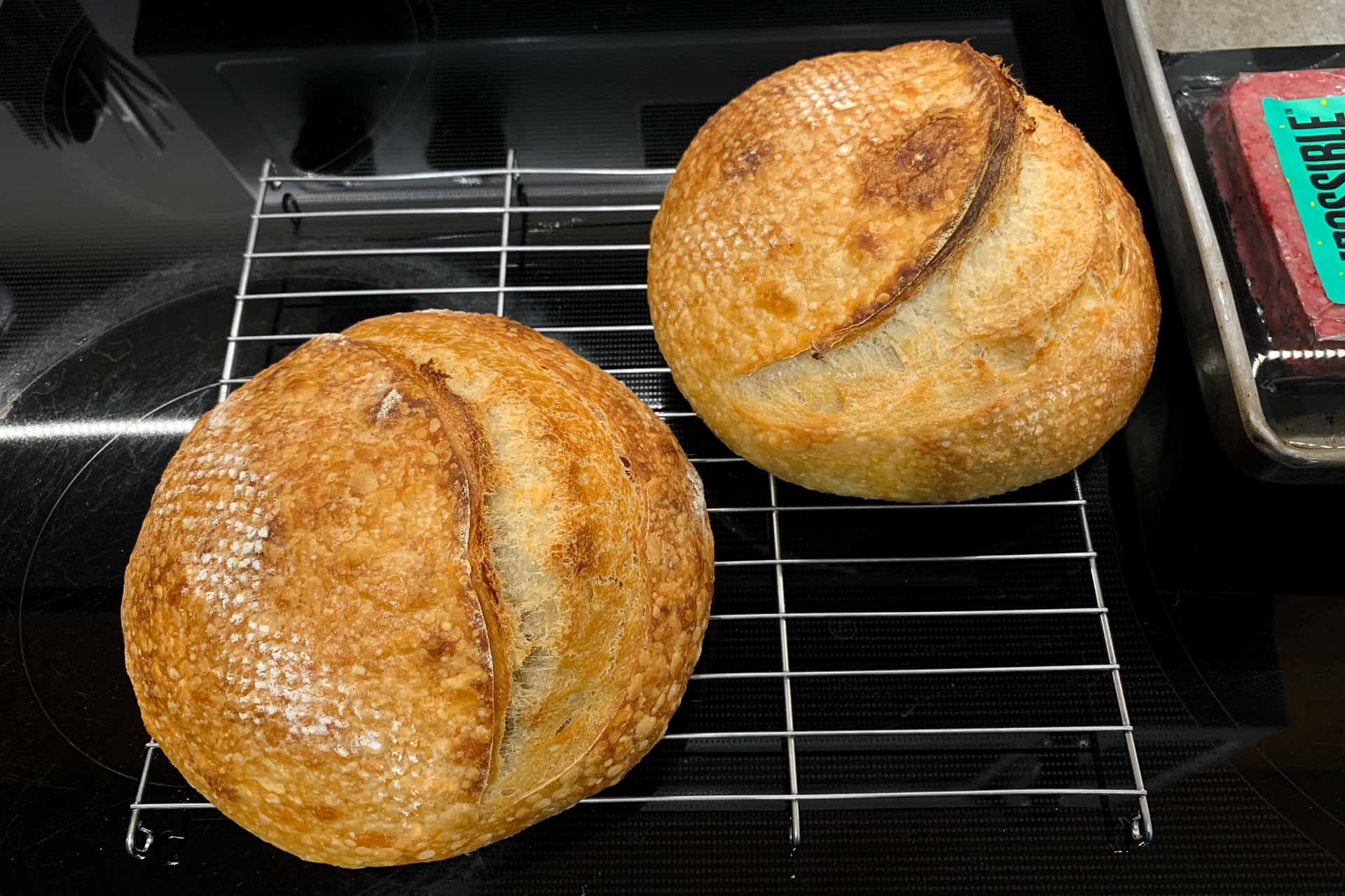 homemade sourdough bread loaves and a retail package of Impossible Burger