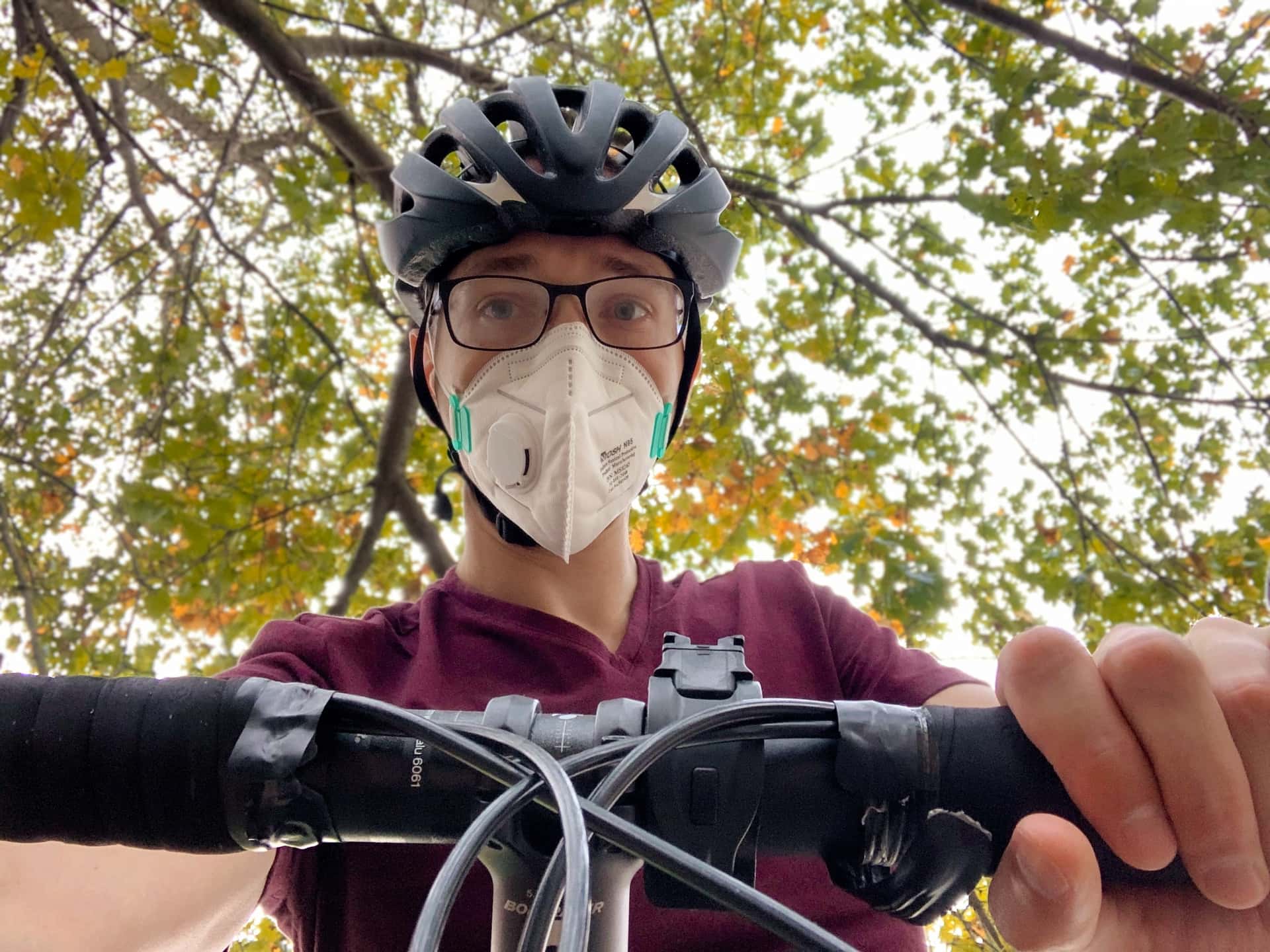 Andrew wearing an industrial N95 respirator on a bicycle in wildfire smoke