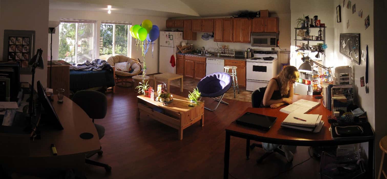 sunlit balloons in an apartment with two desks