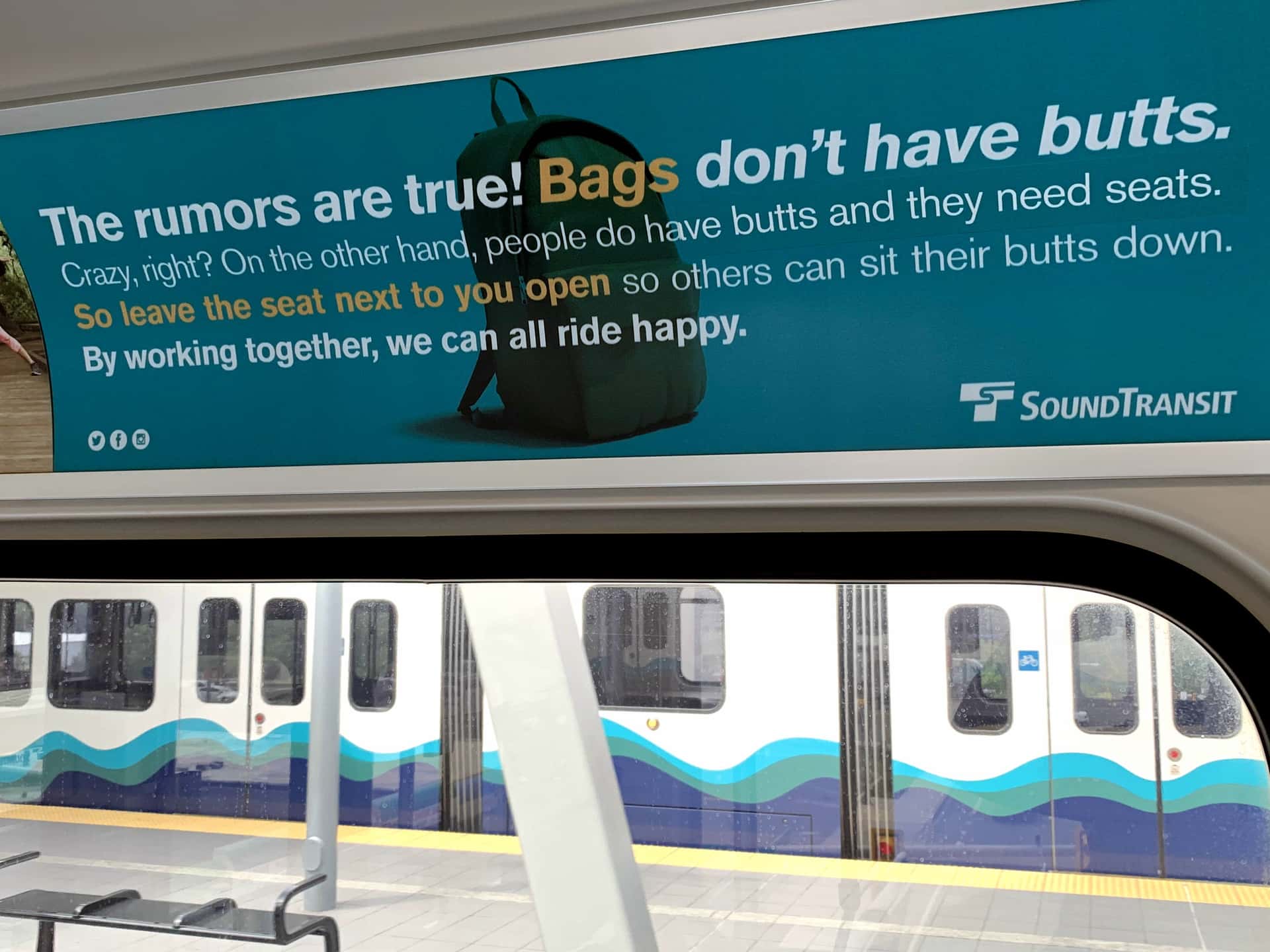 sign inside Link light rail reading “The rumors are true! Bags don’t have butts.”