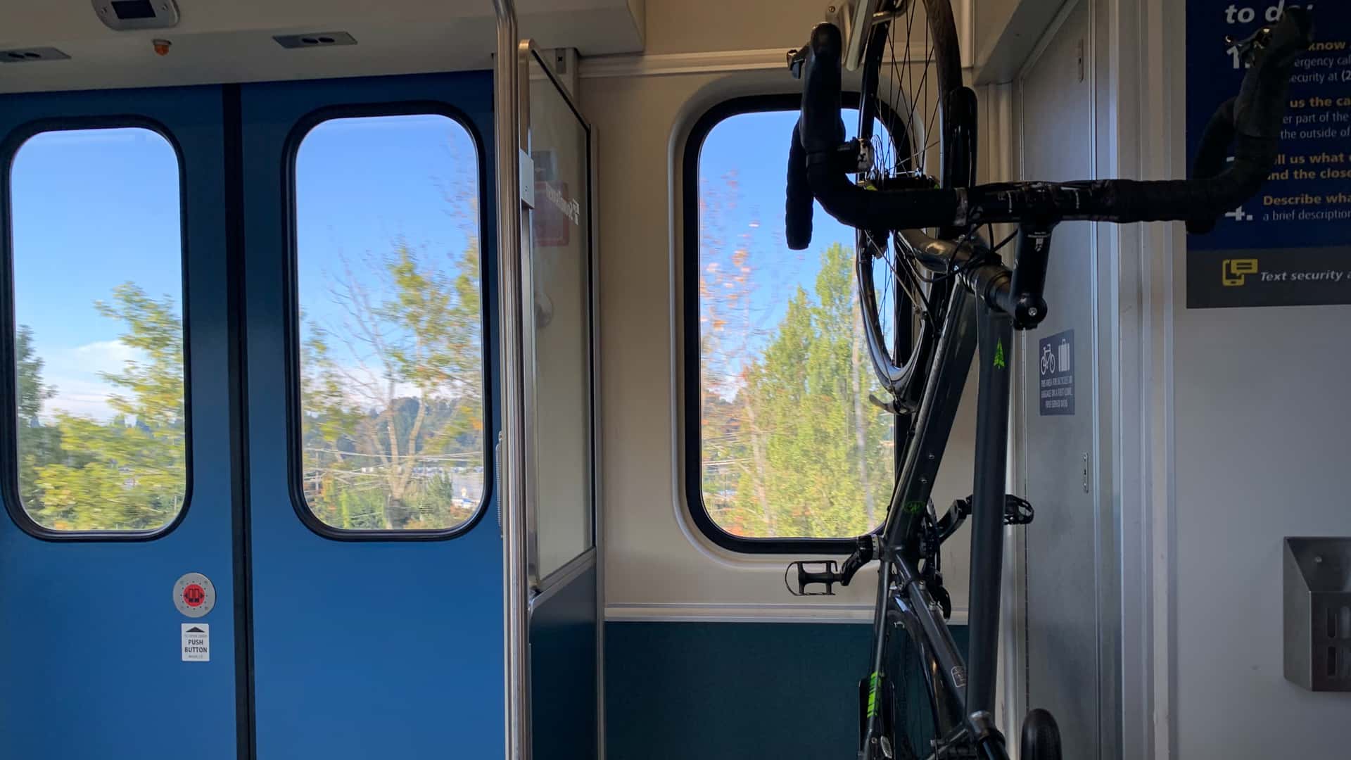 bicycle hanging on a vertical rack on the Link light rail