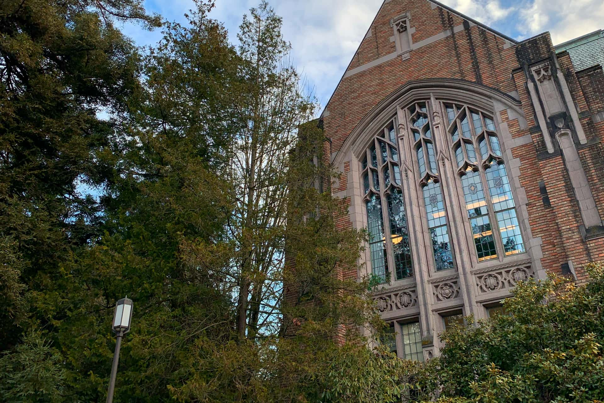 brick exterior of Anderson Hall with stained glass windows into a large room