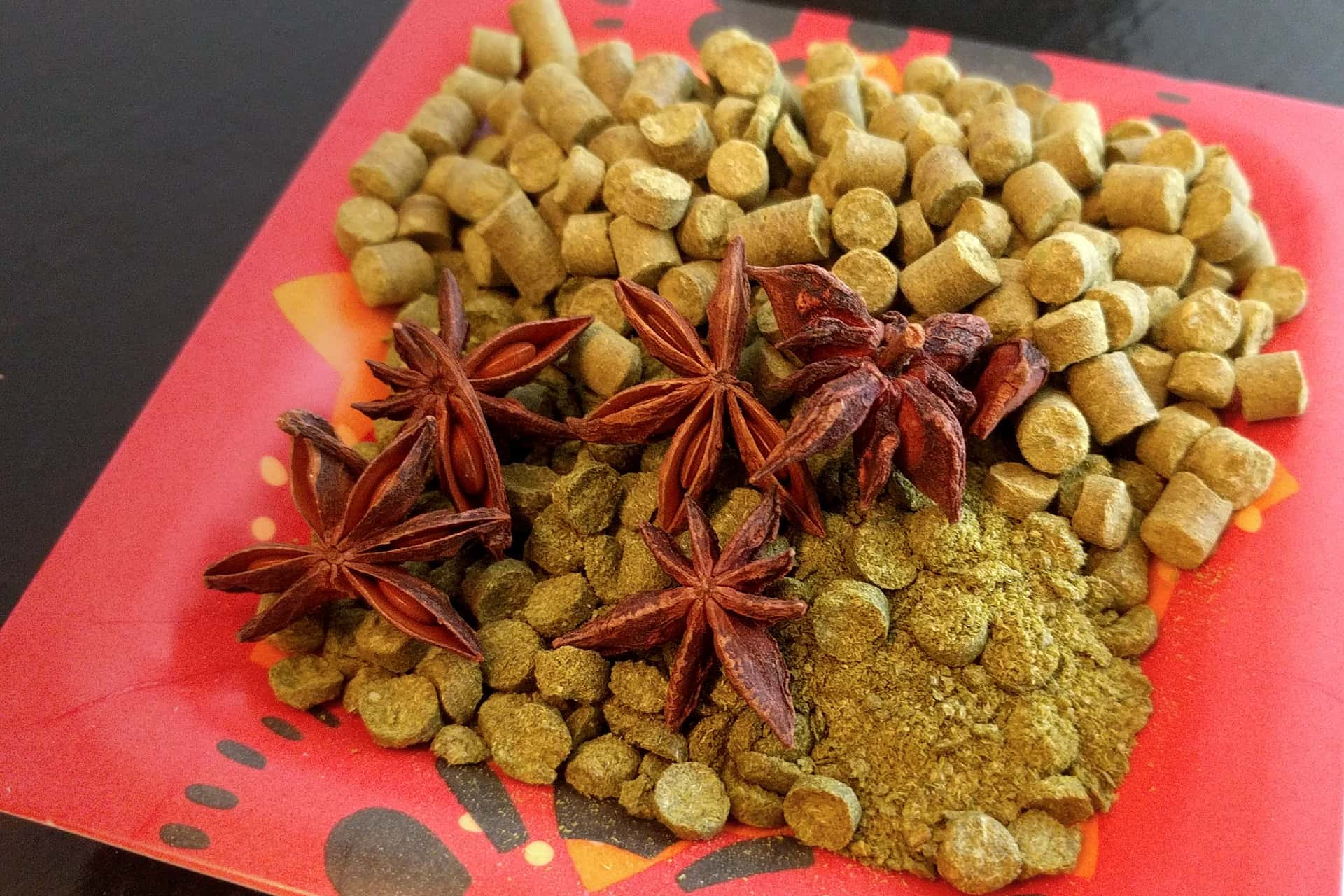 small tray of hop pellets and star anise