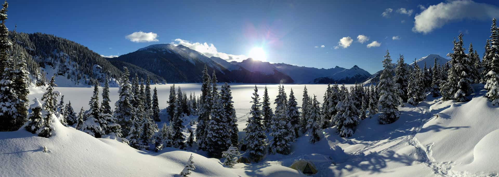 snow-covered campsites at frozen Garibaldi Lake