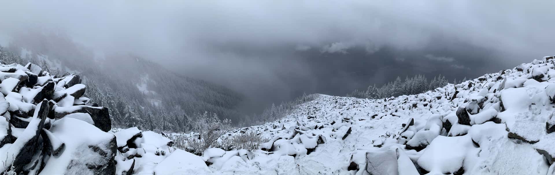 view from snow-covered boulder field on the west side of Mailbox Peak