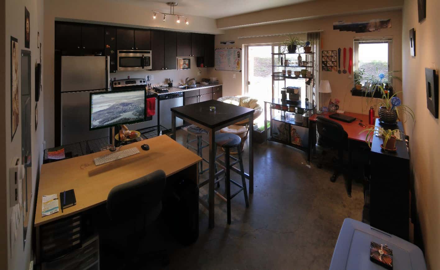 studio apartment kitchen with two desks